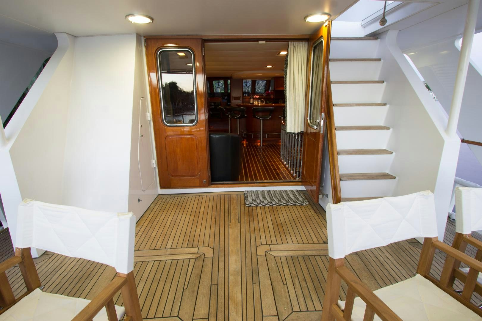 a room with wooden floors and a staircase aboard SEAEO Yacht for Sale