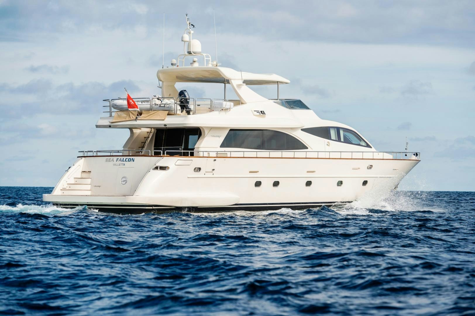 a white yacht in the water aboard SEA FALCON Yacht for Sale