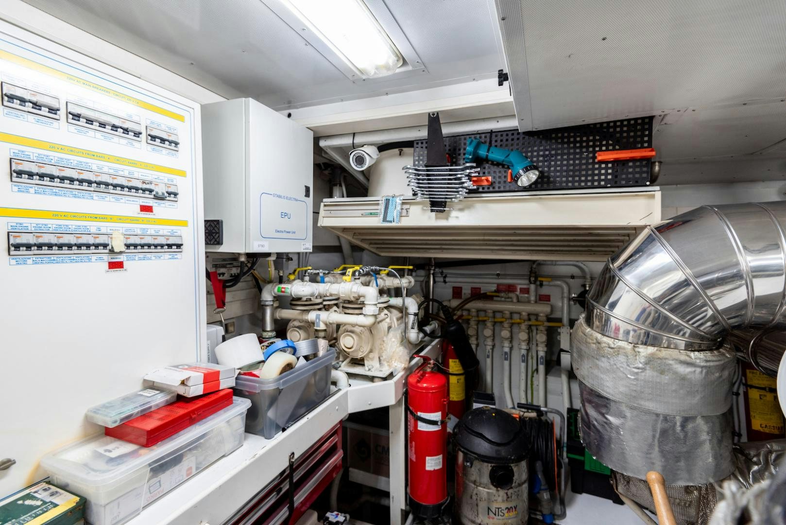 a room with shelves and tools aboard SEA FALCON Yacht for Sale