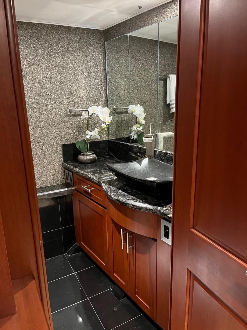 a bathroom with a sink and cabinets aboard CORDINA Yacht for Sale
