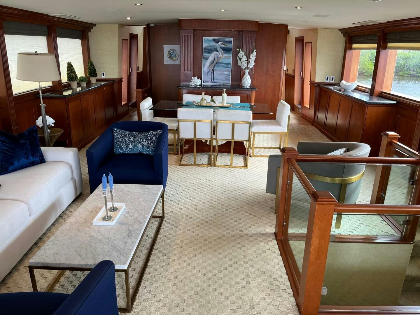 a living room with a couch and a table aboard CORDINA Yacht for Sale