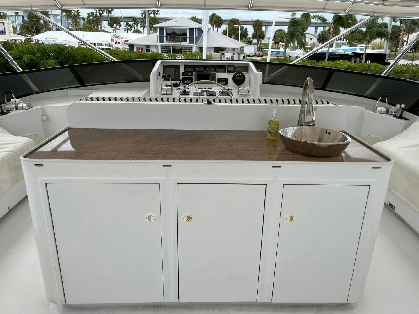 a kitchen with a sink and a large white countertop aboard CORDINA Yacht for Sale