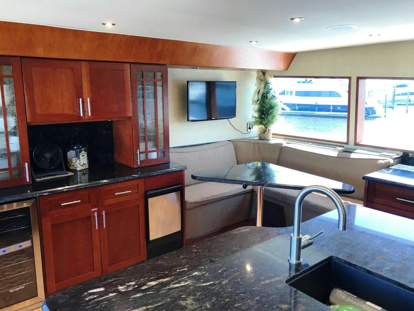 a kitchen with a large island aboard CORDINA Yacht for Sale
