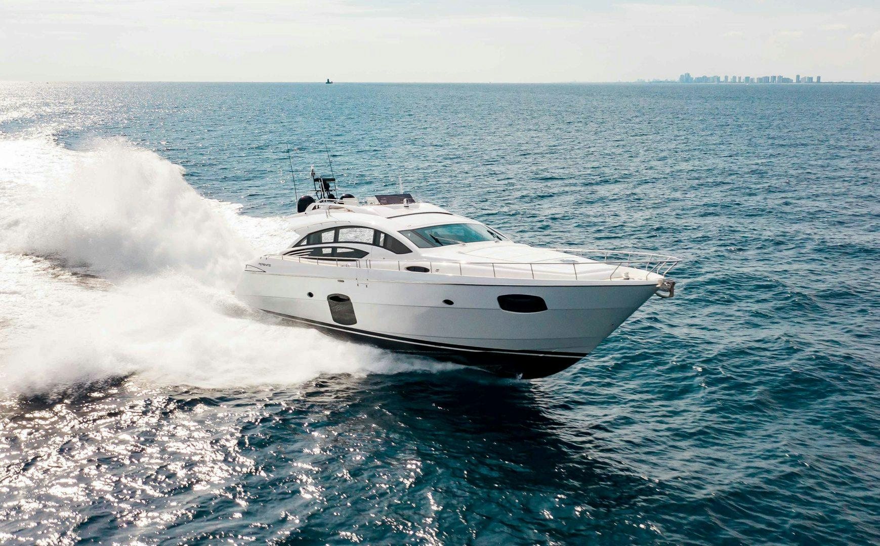 a white yacht on the water aboard JULIE K Yacht for Sale