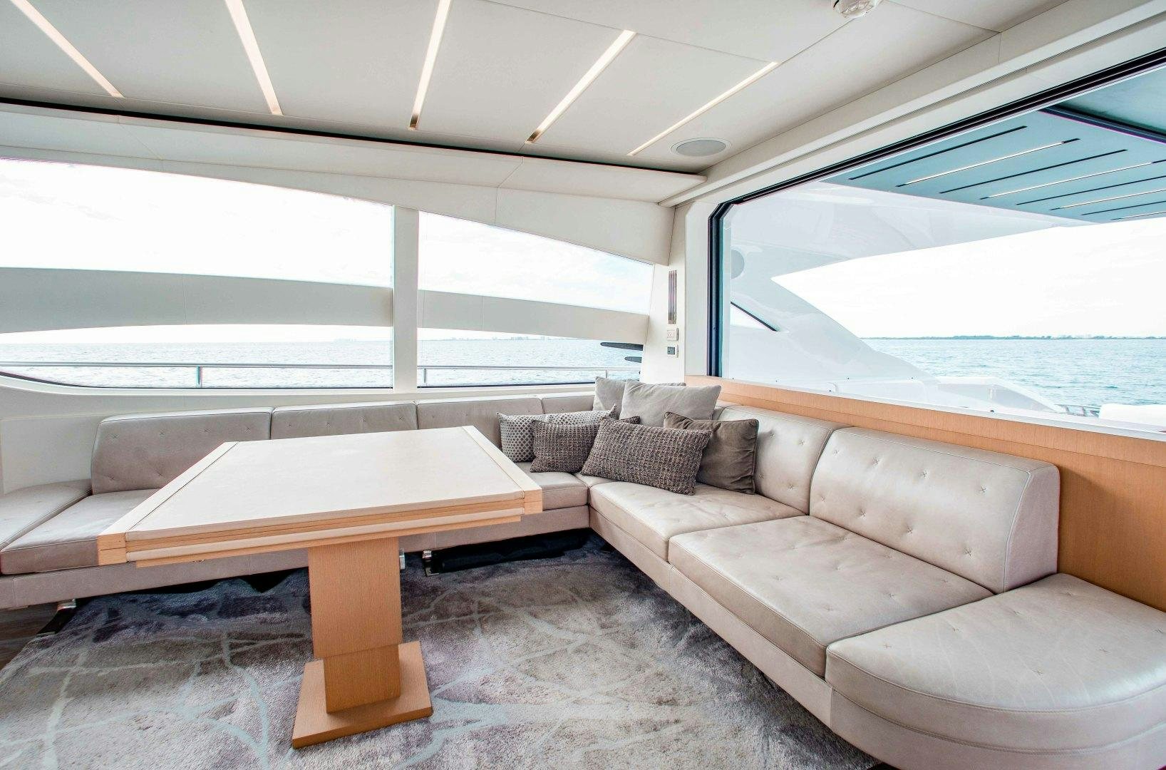 a couch and a table in a boat aboard JULIE K Yacht for Sale