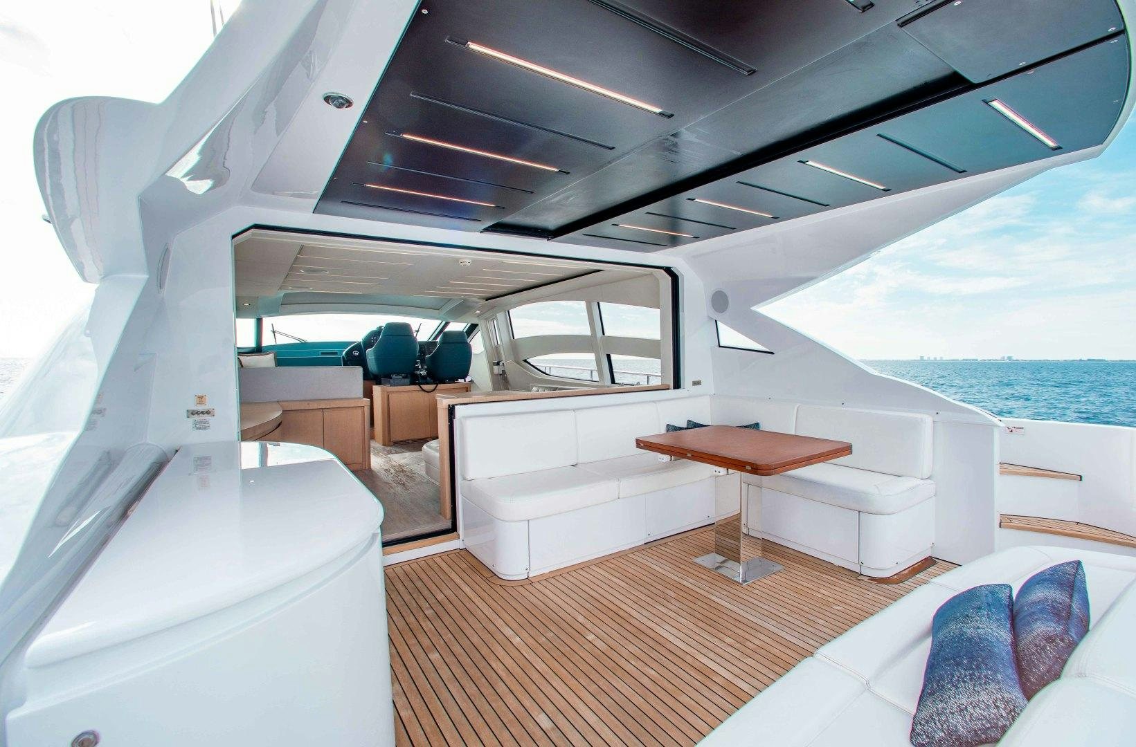 a boat with a table and chairs aboard JULIE K Yacht for Sale