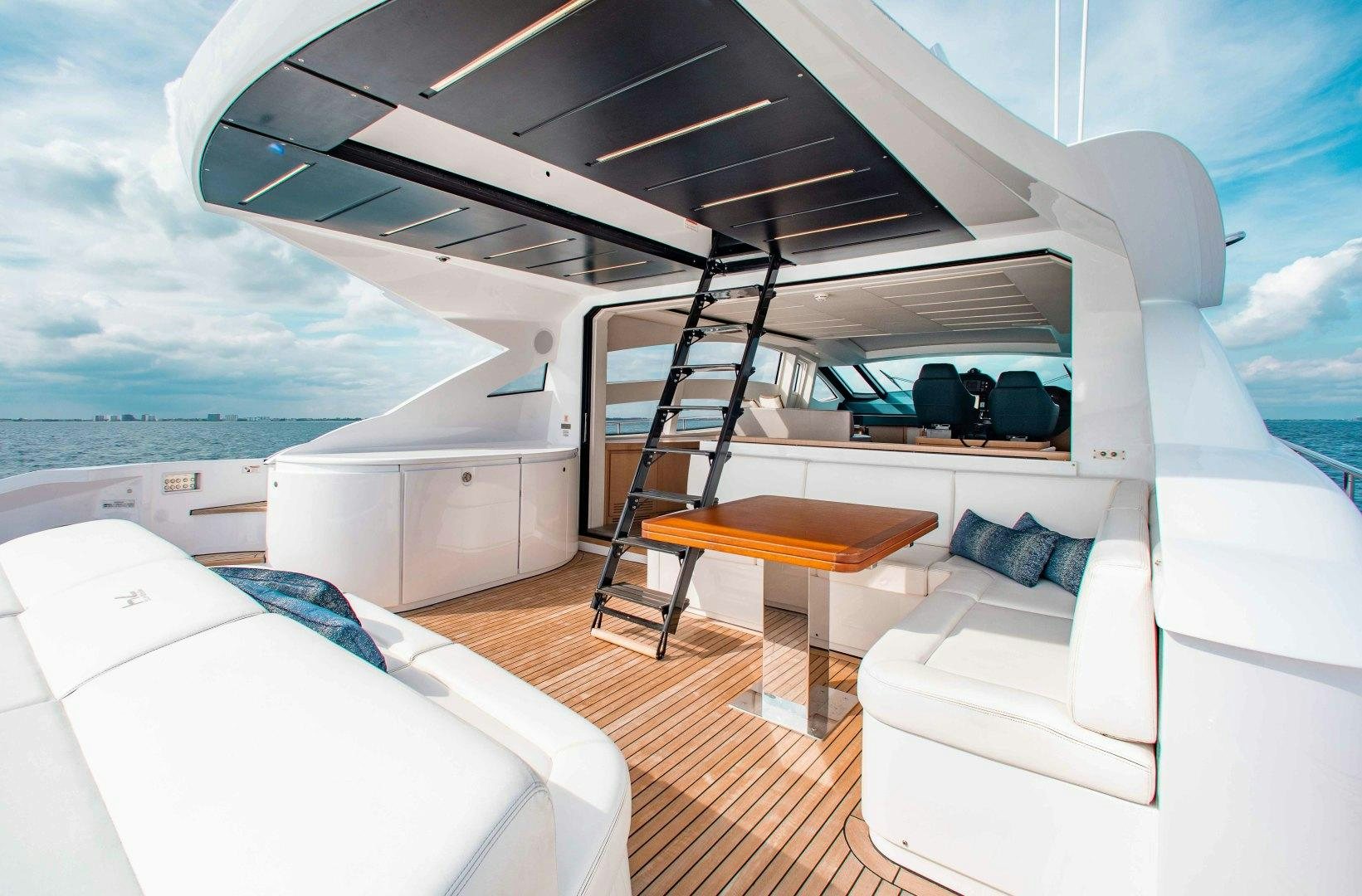 a boat with a table and a bed aboard JULIE K Yacht for Sale