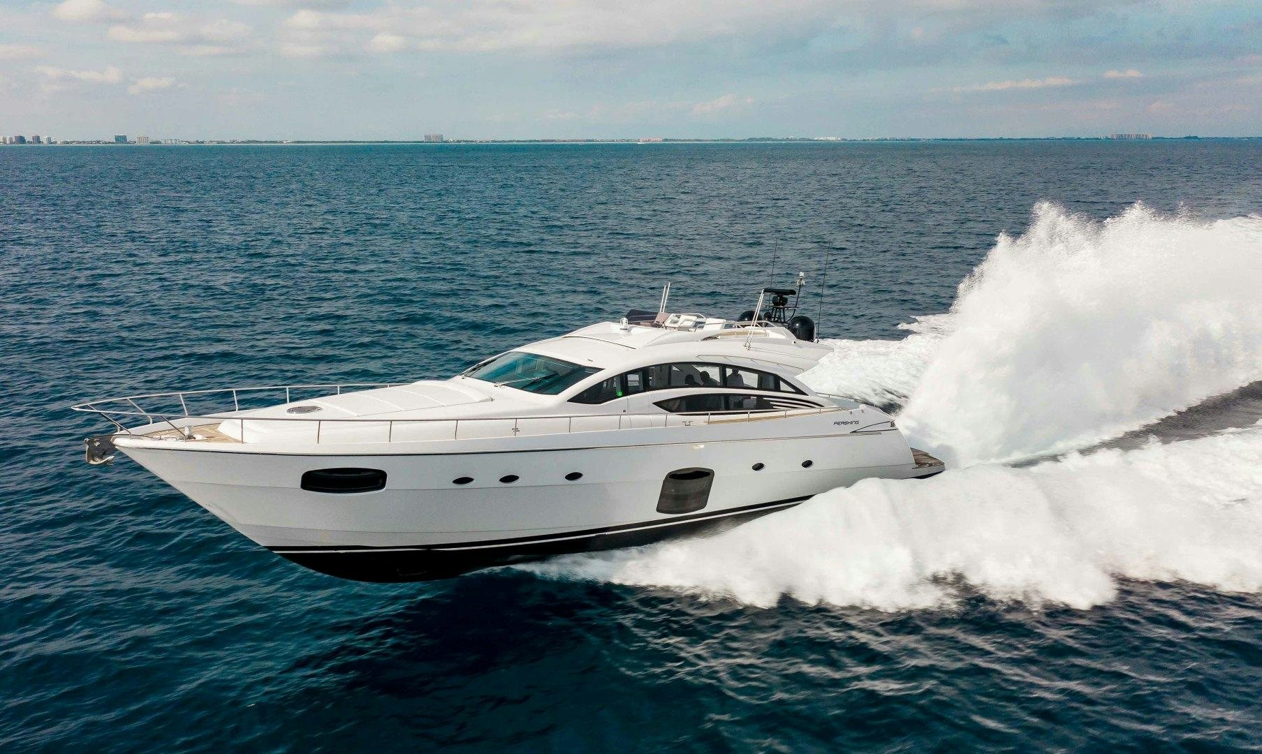 a white yacht on the water aboard JULIE K Yacht for Sale