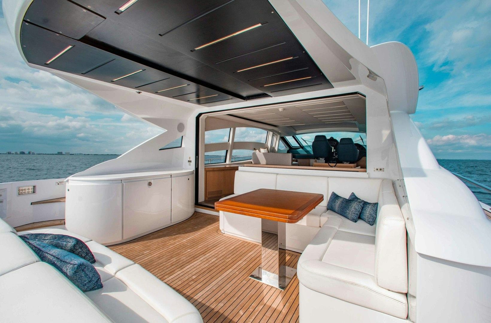 a boat with a table and a bed in it aboard JULIE K Yacht for Sale