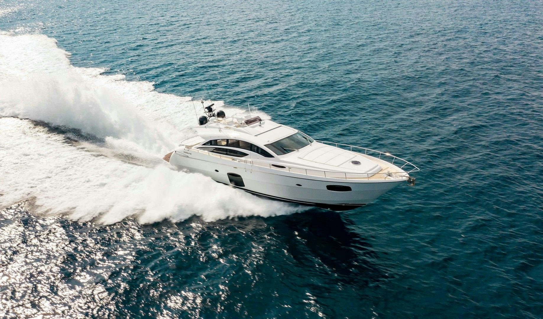 a white yacht on the water aboard JULIE K Yacht for Sale