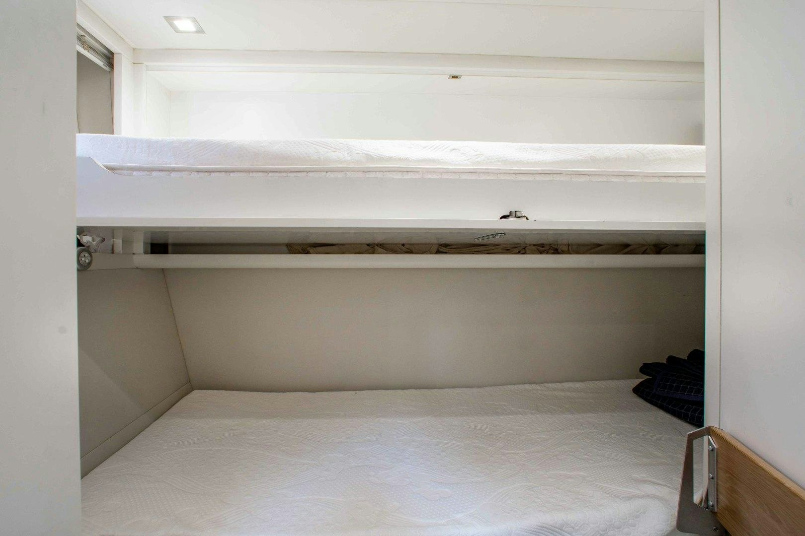 a white shelf with a white mattress aboard JULIE K Yacht for Sale
