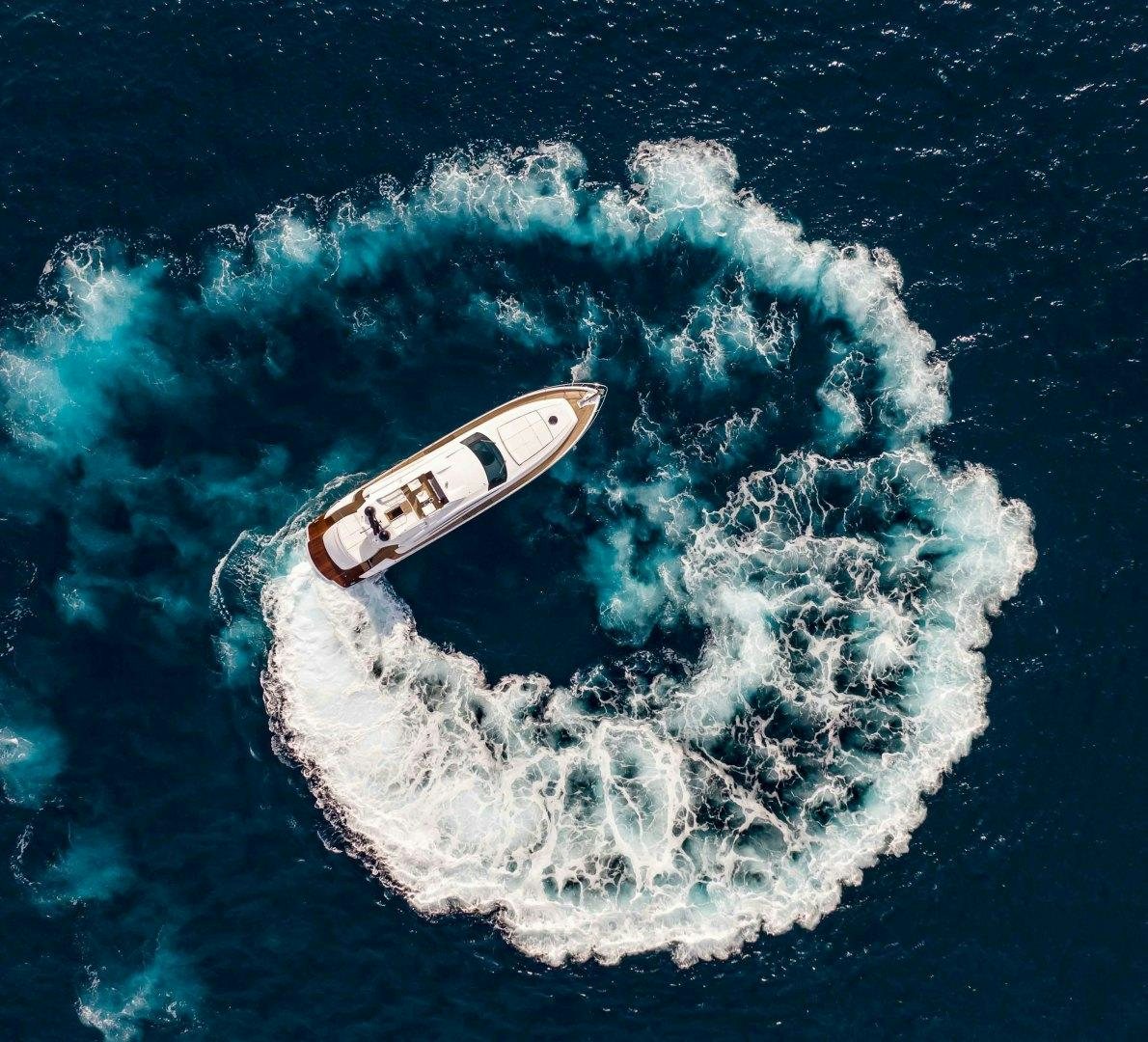a white boat in the water aboard JULIE K Yacht for Sale