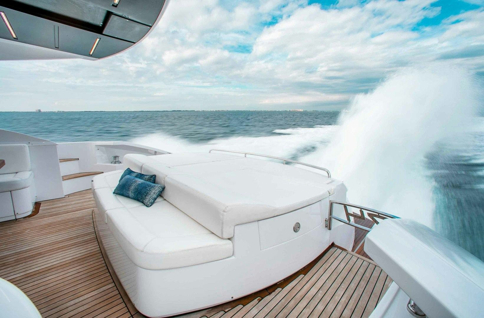 a white boat on a deck aboard JULIE K Yacht for Sale