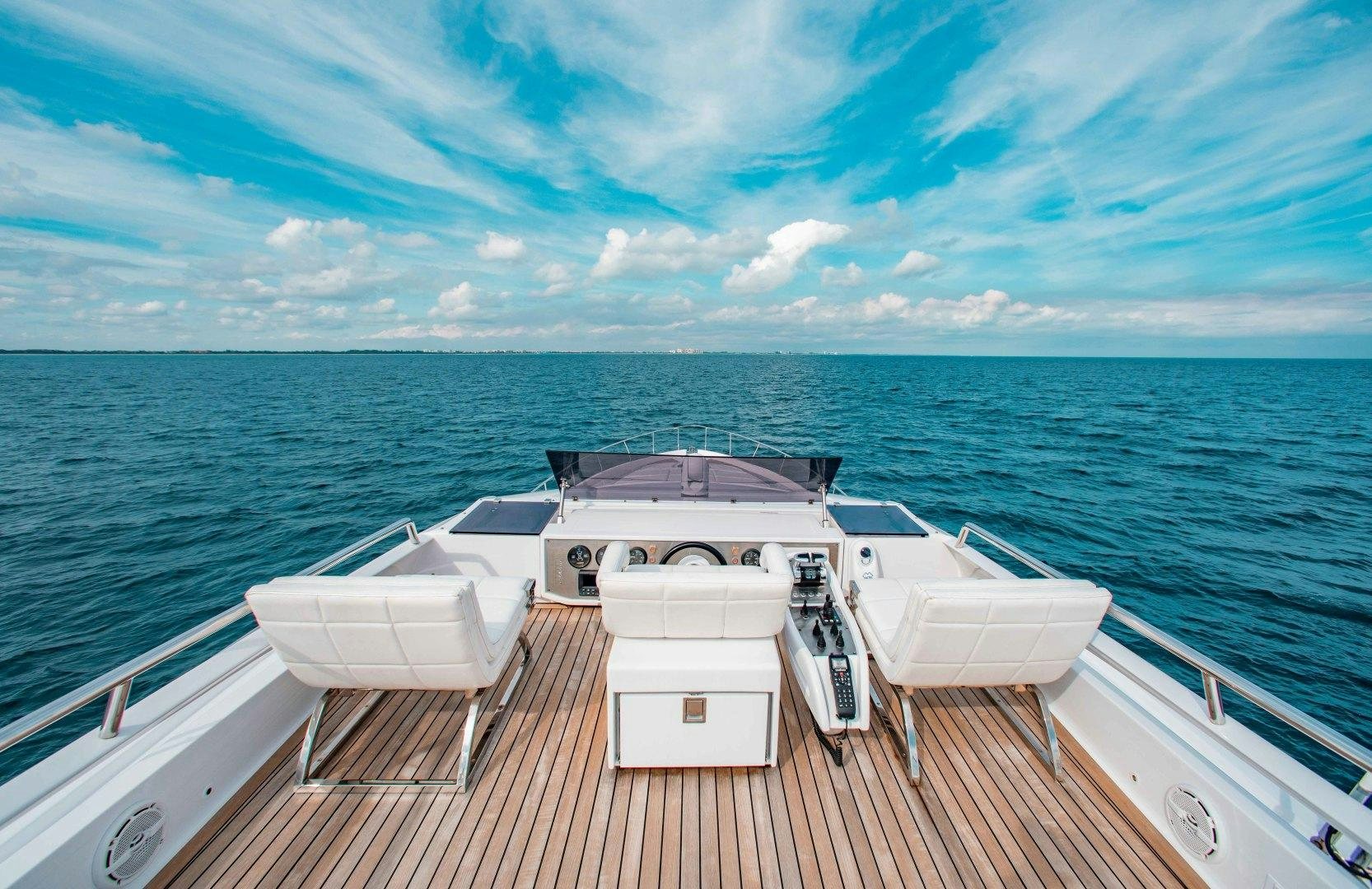 a boat on a deck overlooking the ocean aboard JULIE K Yacht for Sale