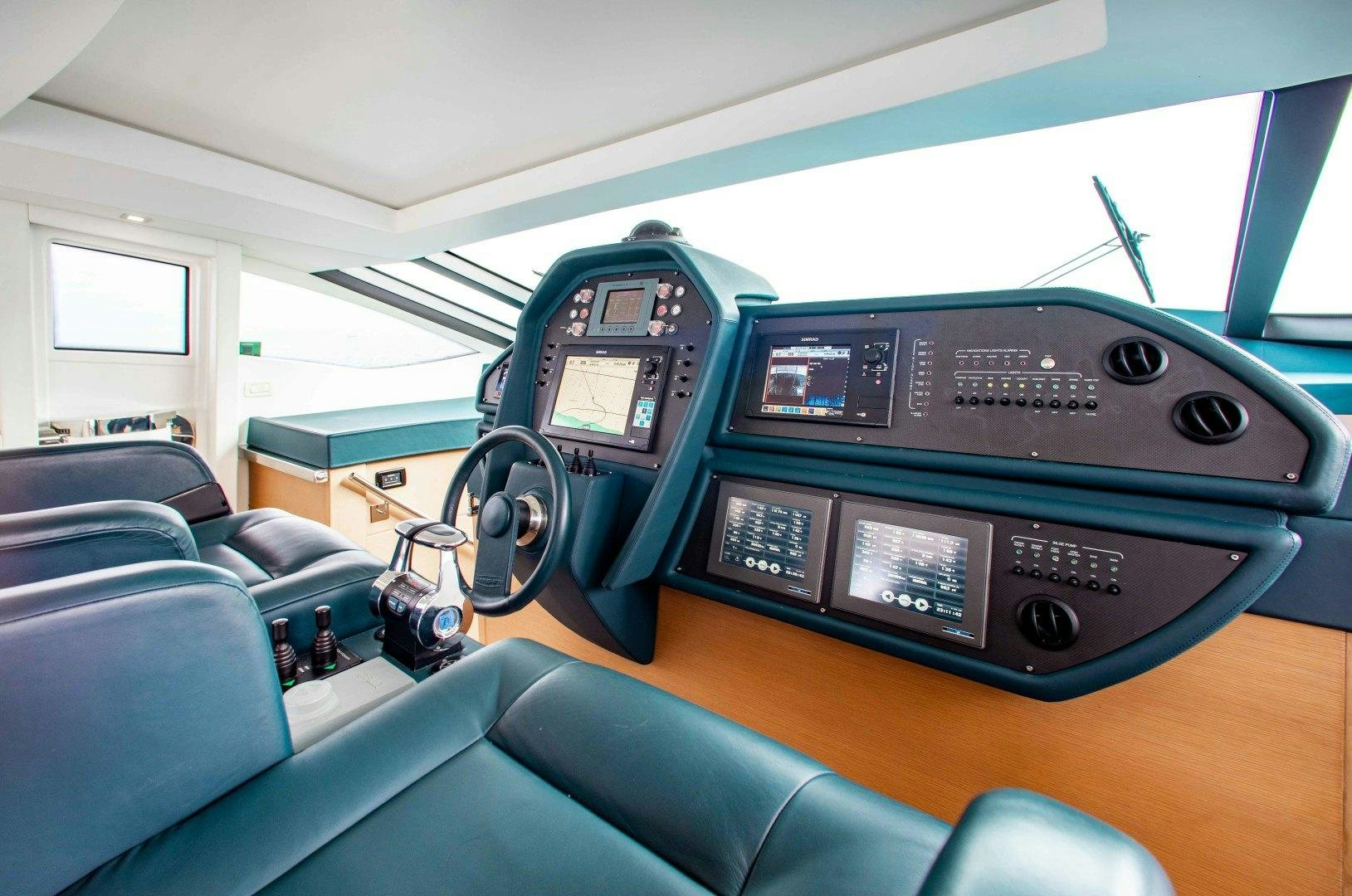 a car with a couple of seats aboard JULIE K Yacht for Sale