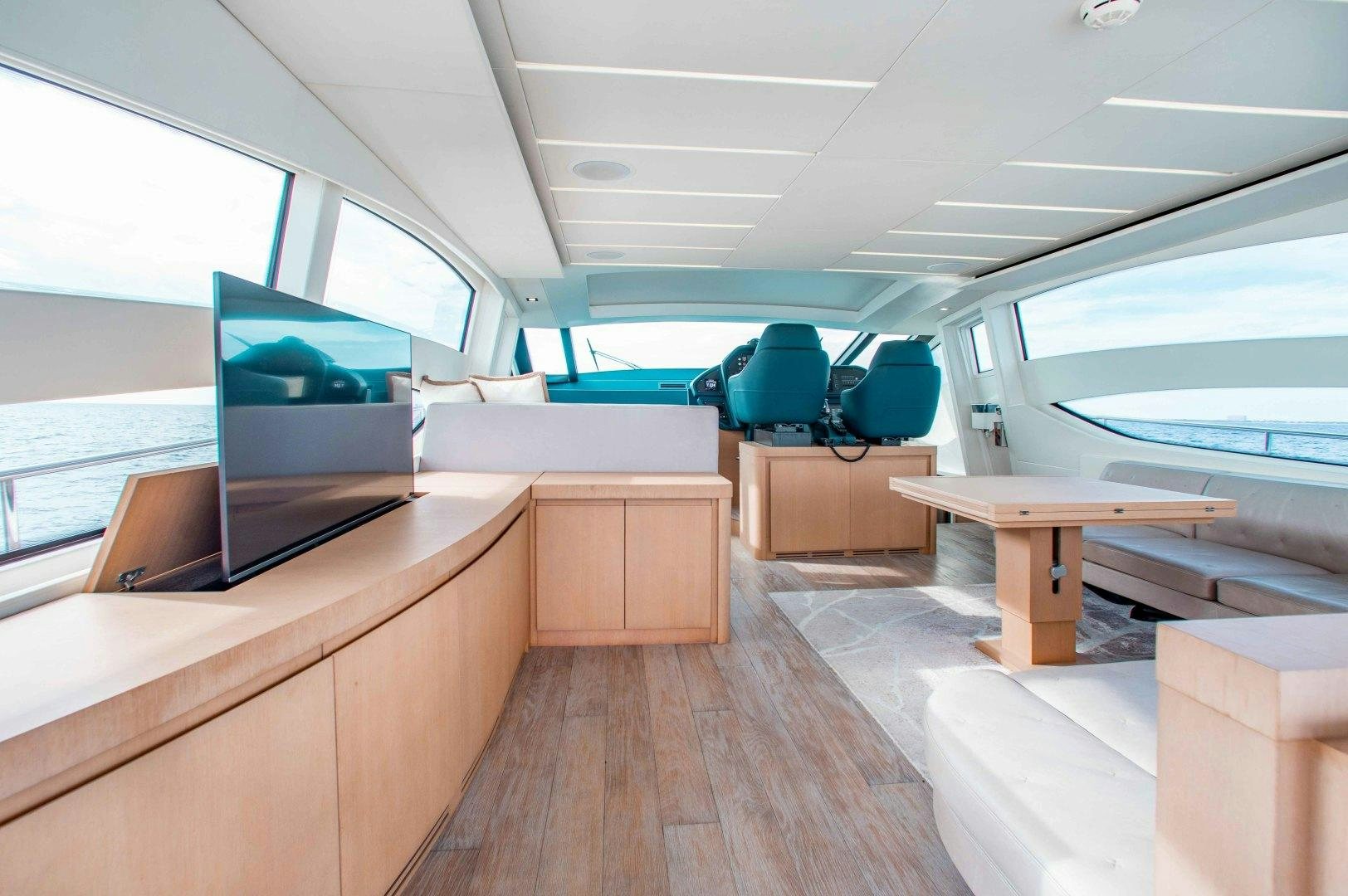 a room with a bed and a desk aboard JULIE K Yacht for Sale