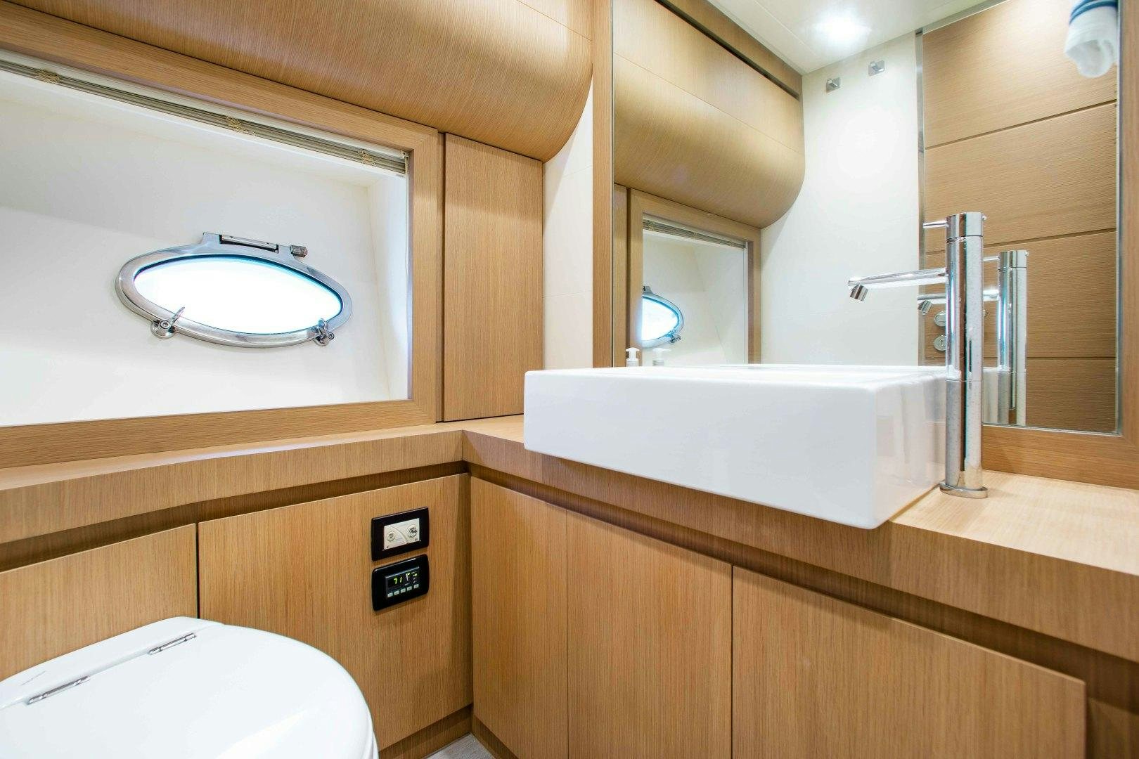 a bathroom with a sink and a toilet aboard JULIE K Yacht for Sale