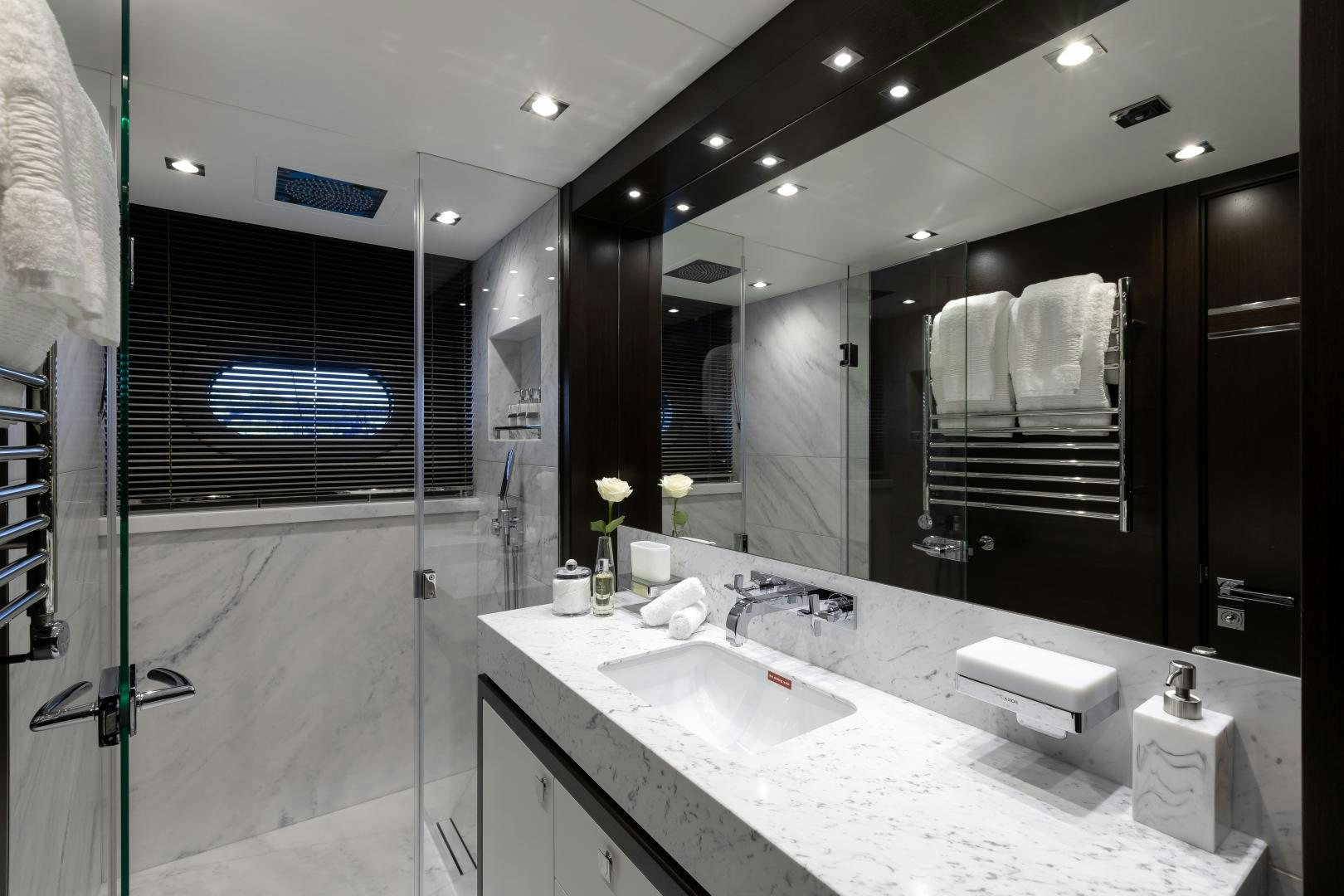 a bathroom with a large mirror aboard SEDATIVE Yacht for Sale