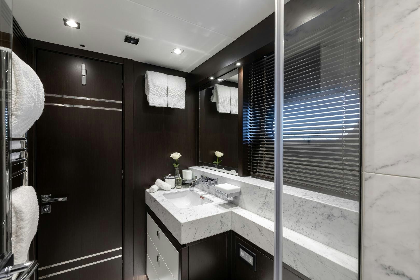 a bathroom with a sink and a mirror aboard SEDATIVE Yacht for Sale