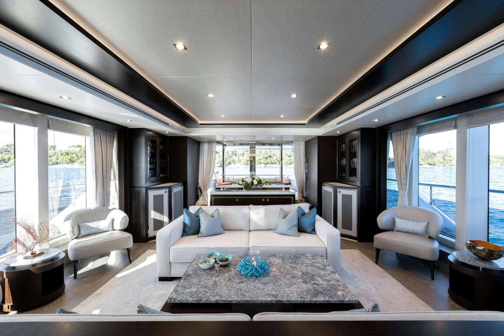 a living room with a large window aboard SEDATIVE Yacht for Sale