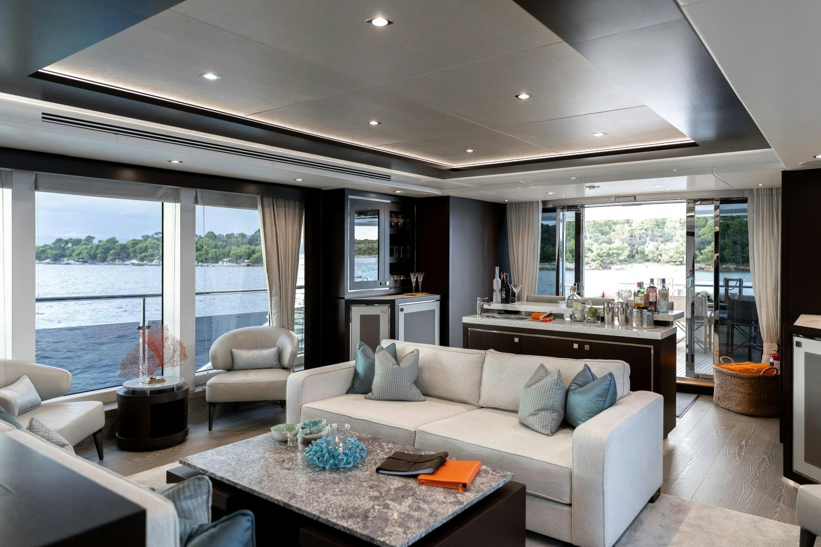 a living room with a large window aboard SEDATIVE Yacht for Sale