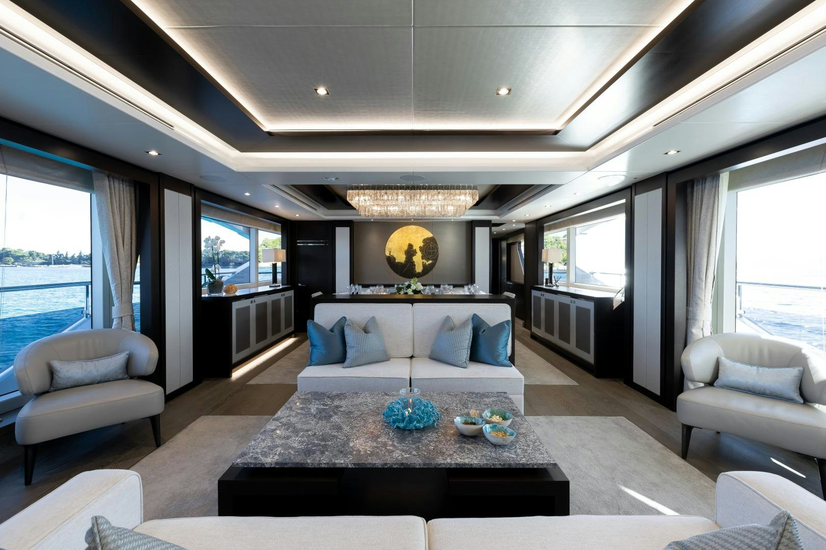 a living room with a large couch aboard SEDATIVE Yacht for Sale