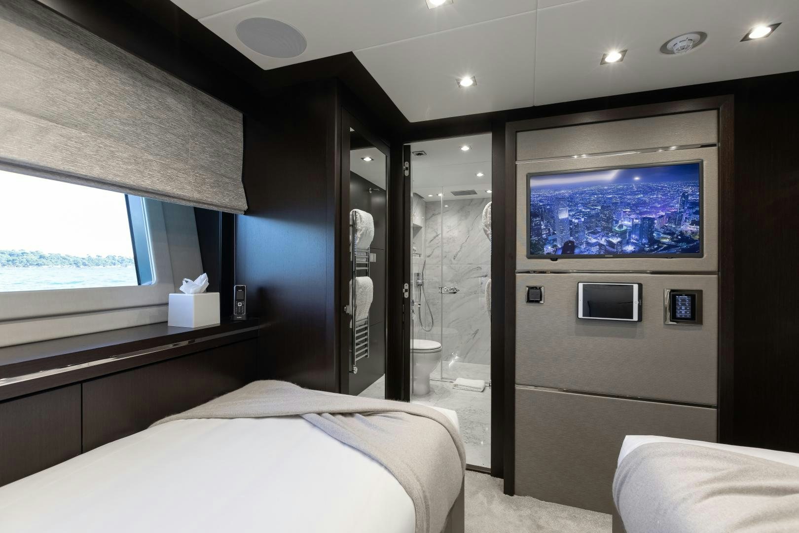 a room with a tv and a bed aboard SEDATIVE Yacht for Sale