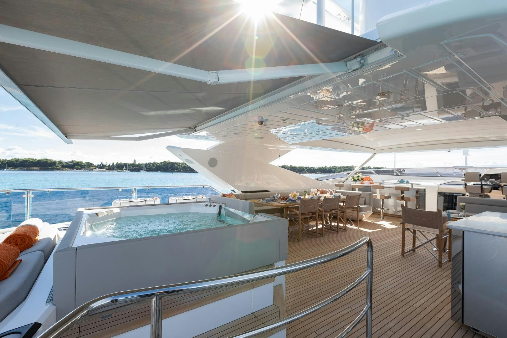 a large white lounge chair next to a pool and a deck with a large pool and a deck aboard SEDATIVE Yacht for Sale