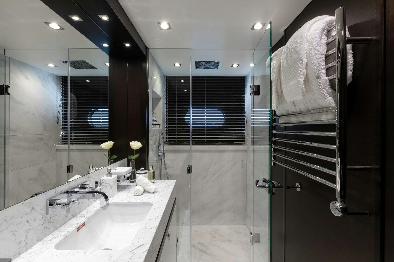 a bathroom with a sink and a mirror aboard SEDATIVE Yacht for Sale