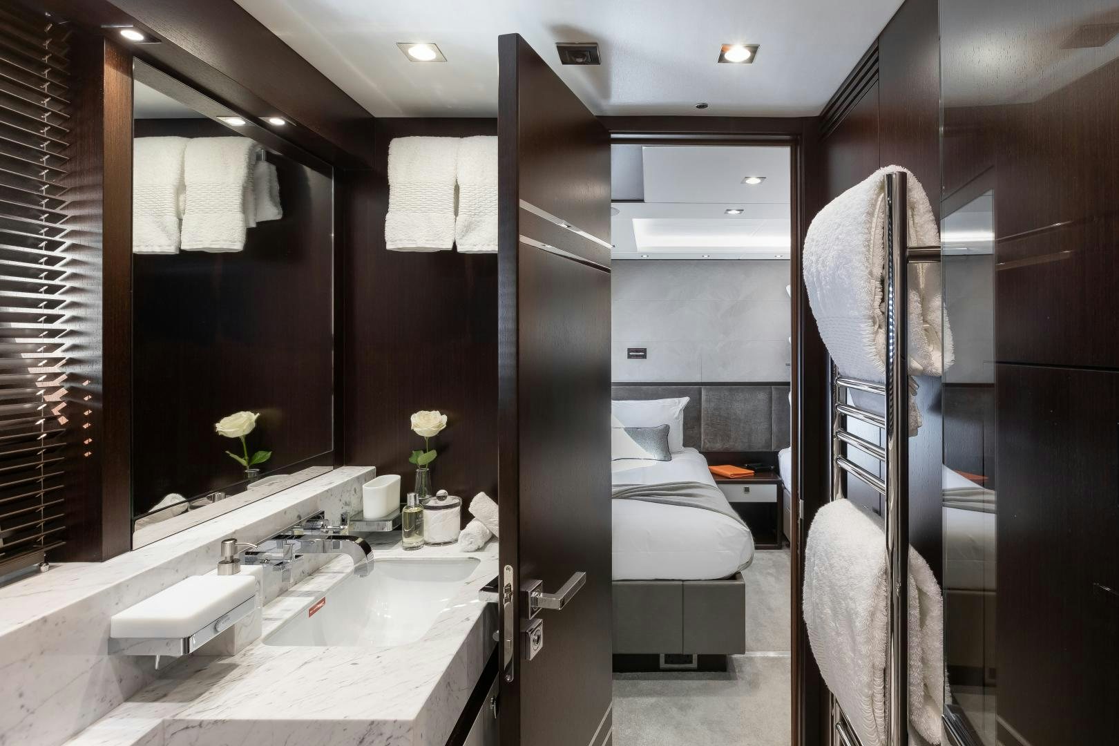 a bathroom with a sink and a mirror aboard SEDATIVE Yacht for Sale