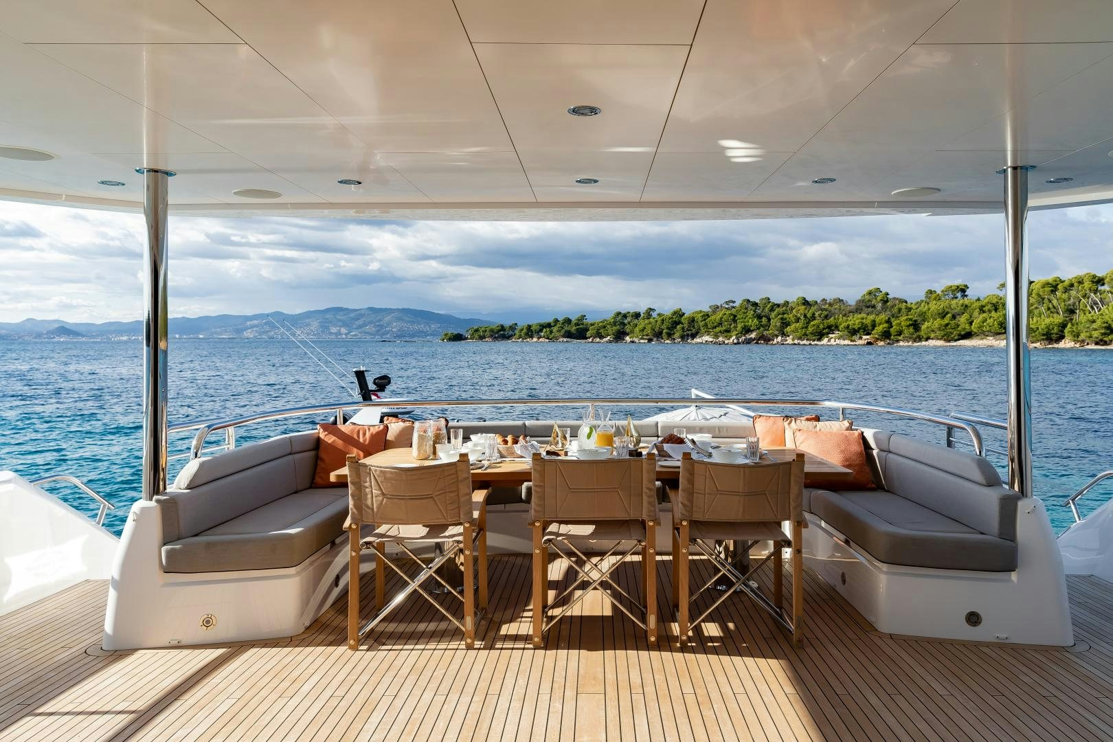 a room with a table and chairs on it aboard SEDATIVE Yacht for Sale