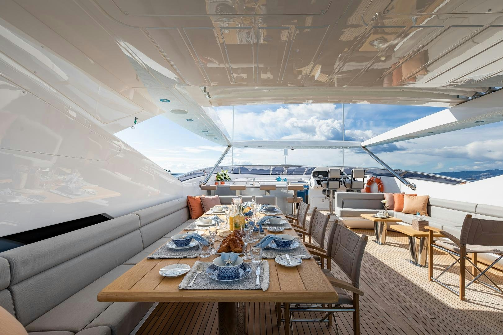 a room with tables and chairs aboard SEDATIVE Yacht for Sale