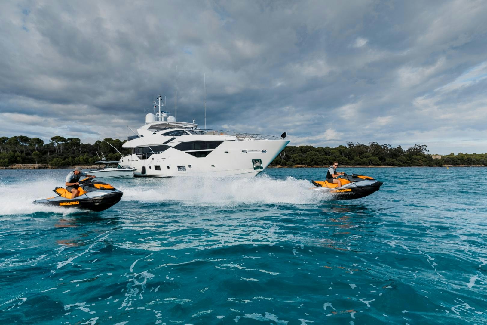 a boat and a couple of people in the water aboard SEDATIVE Yacht for Sale