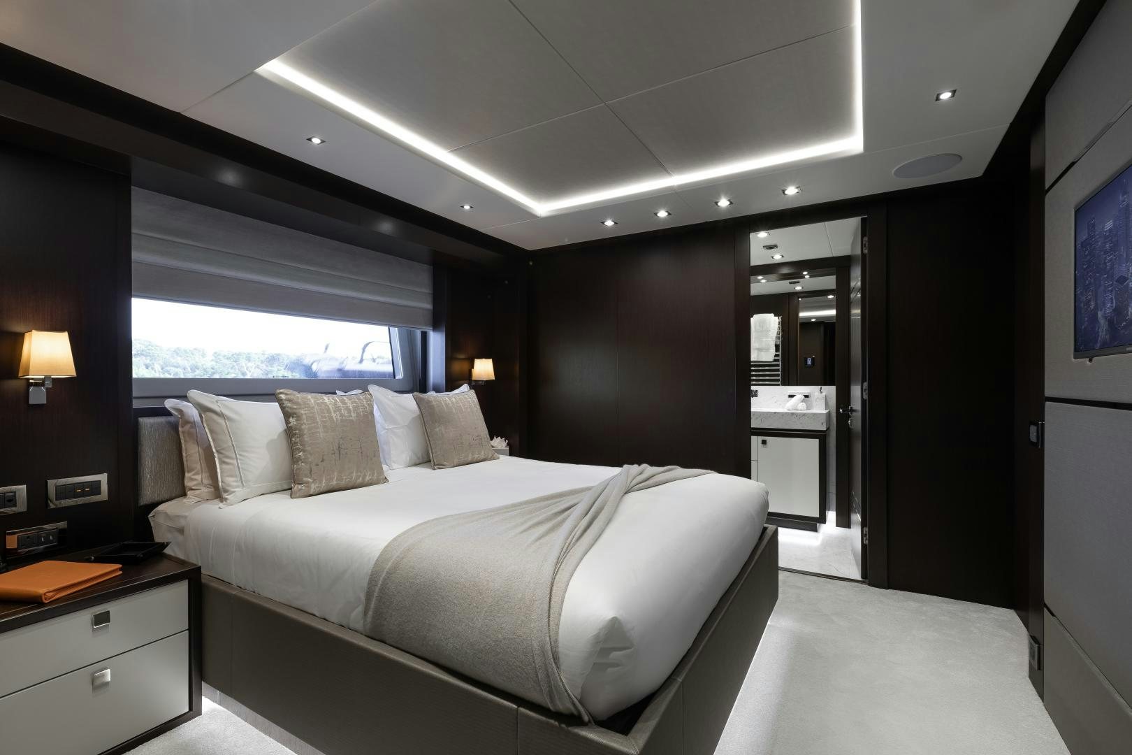 a room with a bed and a window aboard SEDATIVE Yacht for Sale