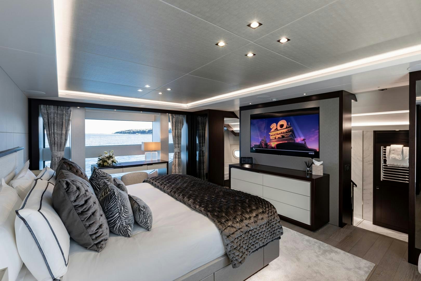 a bedroom with a large tv aboard SEDATIVE Yacht for Sale