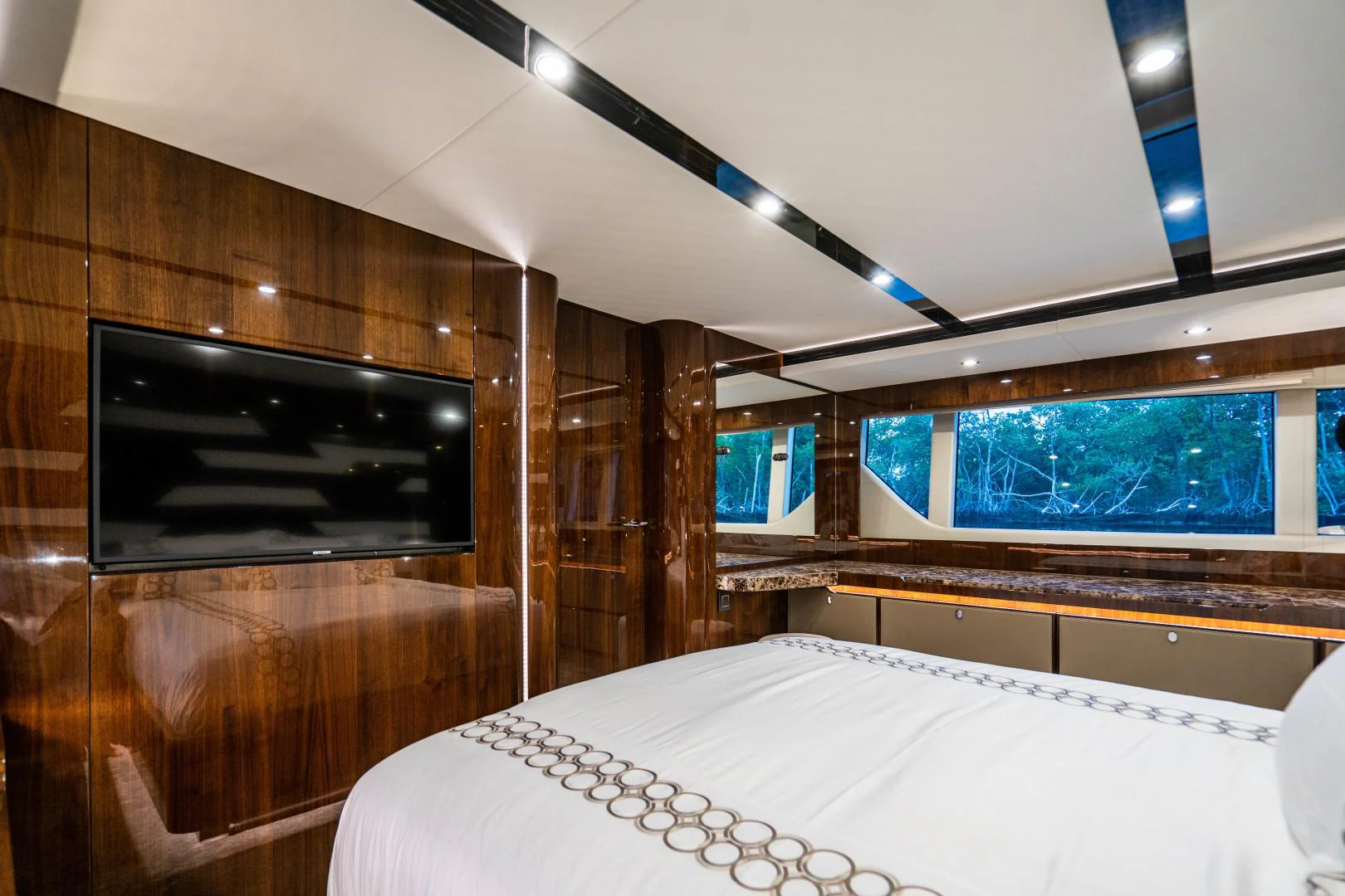 a room with a bed and a television aboard BLIND DATE Yacht for Sale