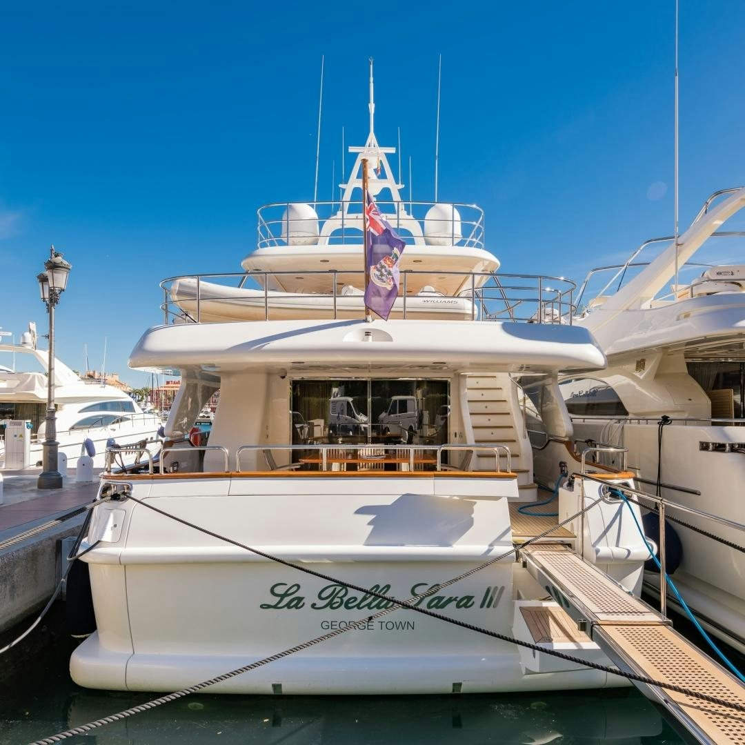 a boat docked at a pier aboard LA BELLA SARA III Yacht for Sale