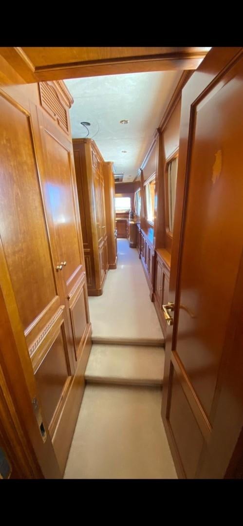a hallway with wooden doors aboard LA BELLA SARA III Yacht for Sale