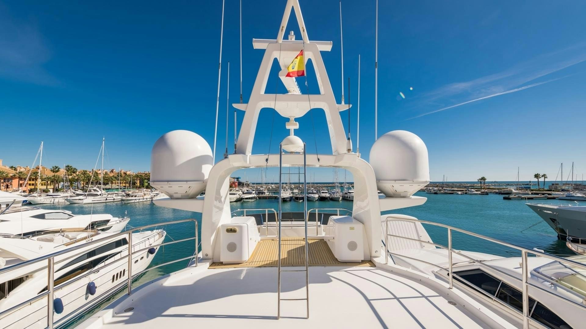 a white boat on a dock aboard LA BELLA SARA III Yacht for Sale