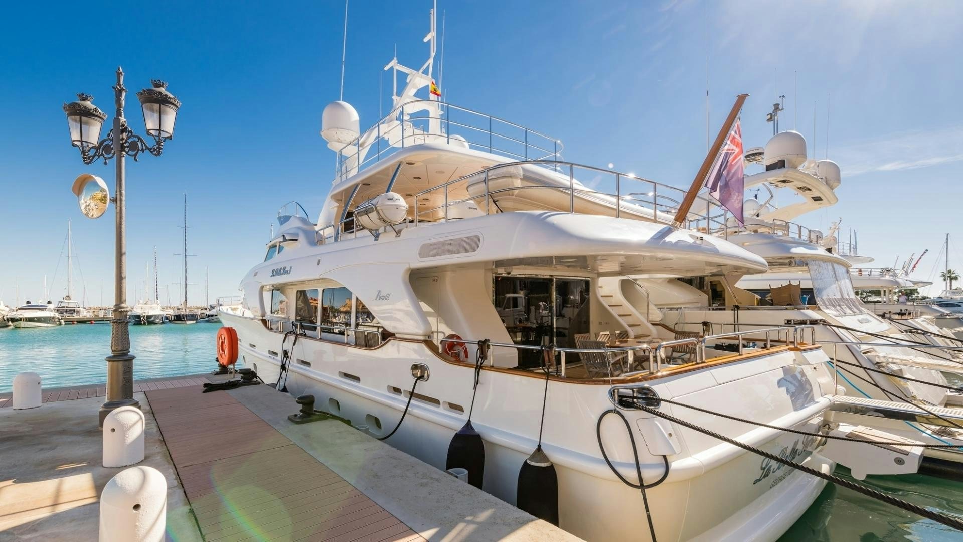 a boat docked at a pier aboard LA BELLA SARA III Yacht for Sale