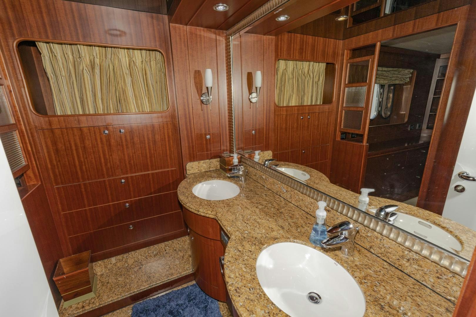 a bathroom with two sinks aboard VIAGGIO Yacht for Sale
