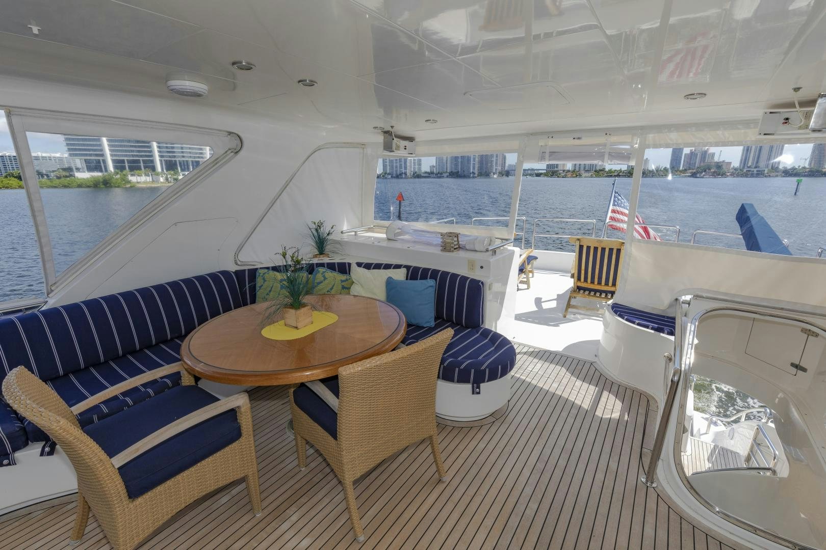 a boat with a table and chairs aboard VIAGGIO Yacht for Sale