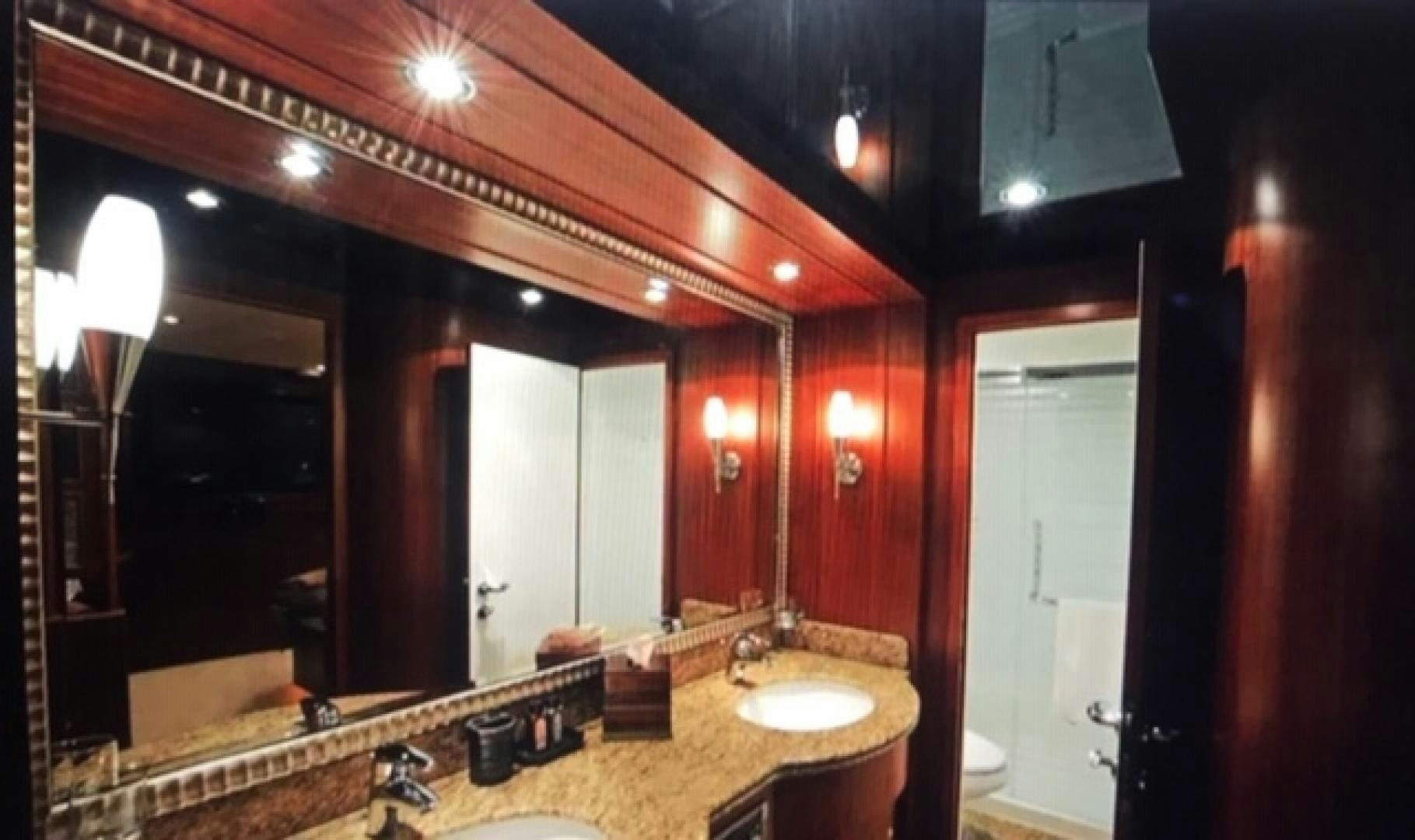 a bathroom with a large mirror aboard VIAGGIO Yacht for Sale