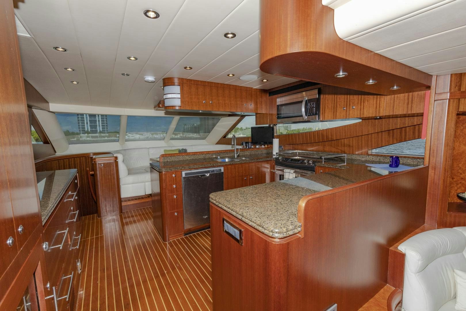 a kitchen with a bar and a bar aboard VIAGGIO Yacht for Sale