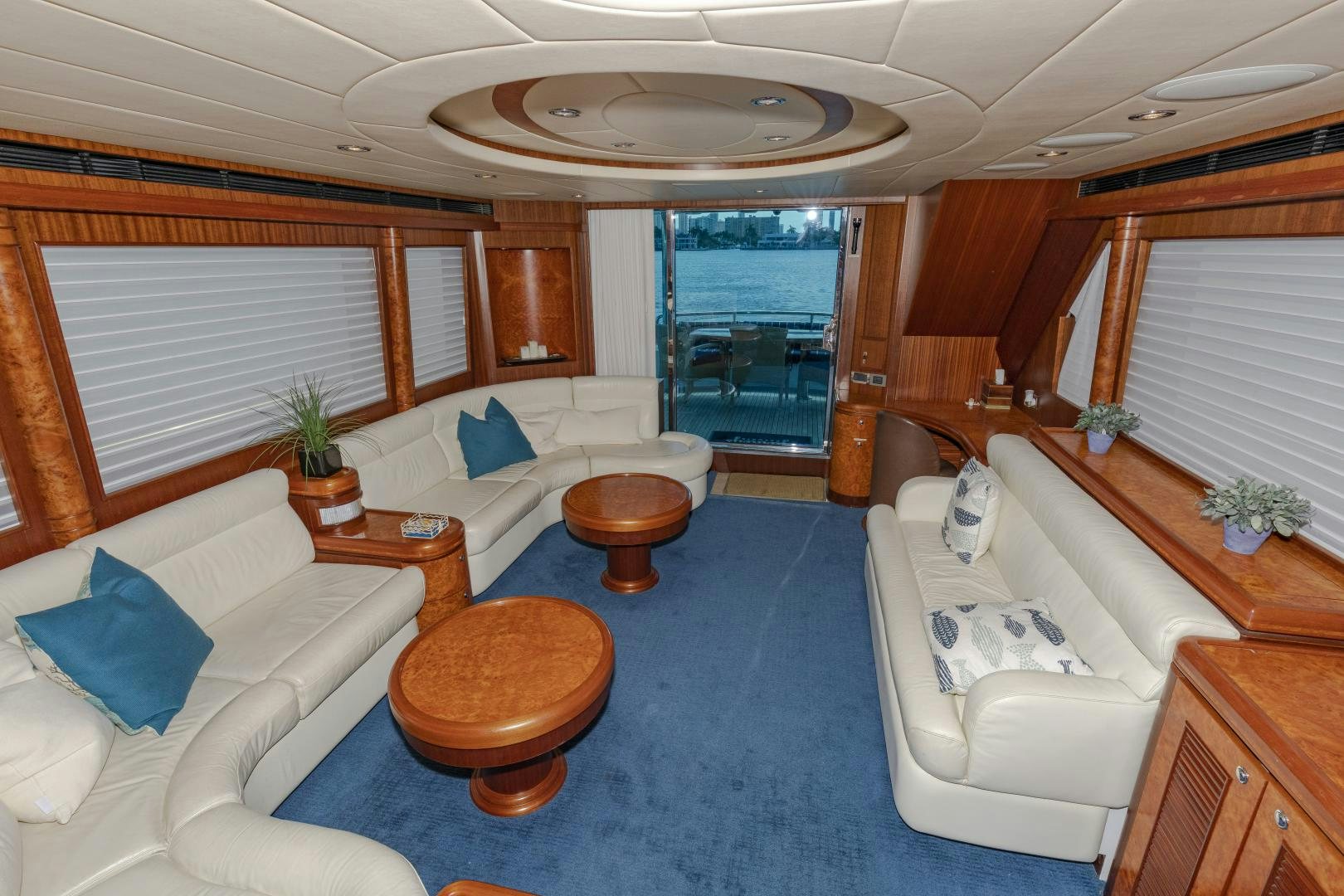 a room with a couch and a table and a window aboard VIAGGIO Yacht for Sale