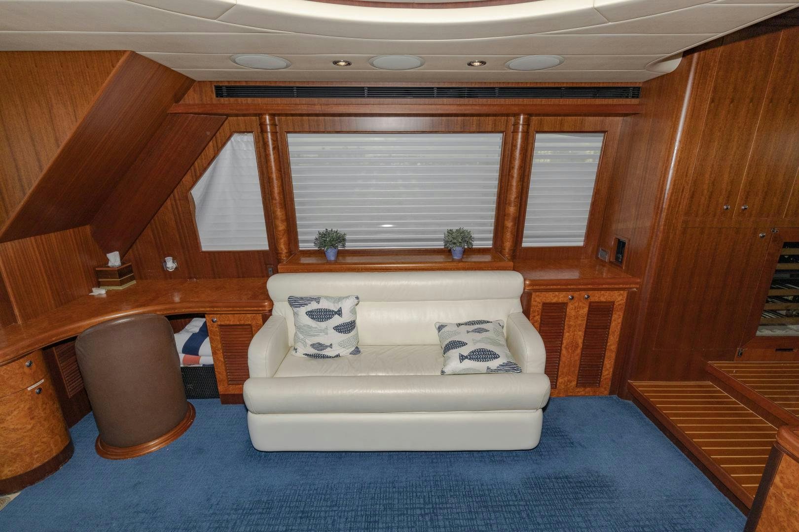 a room with a couch and a chair aboard VIAGGIO Yacht for Sale