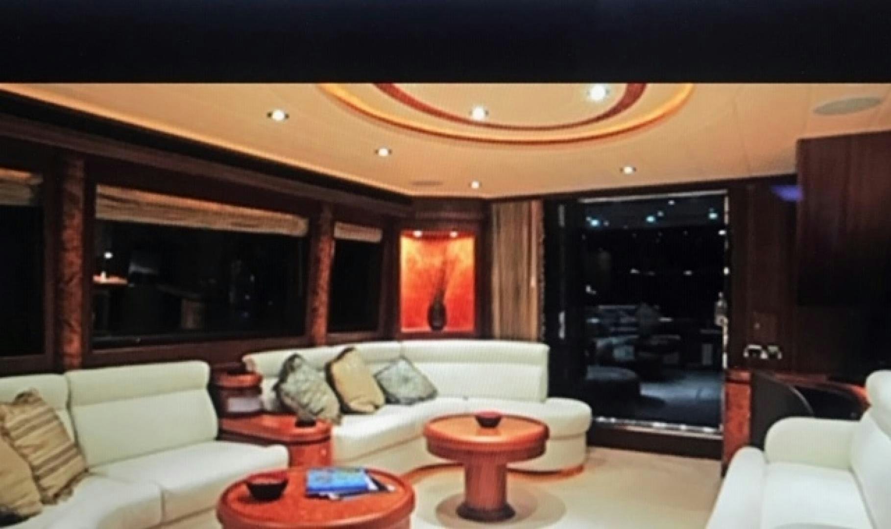 a living room with a fireplace aboard VIAGGIO Yacht for Sale