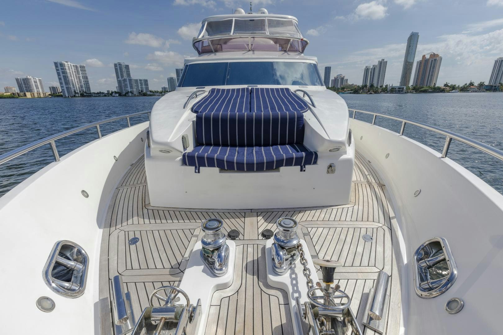 a deck with a large ship in the background aboard VIAGGIO Yacht for Sale