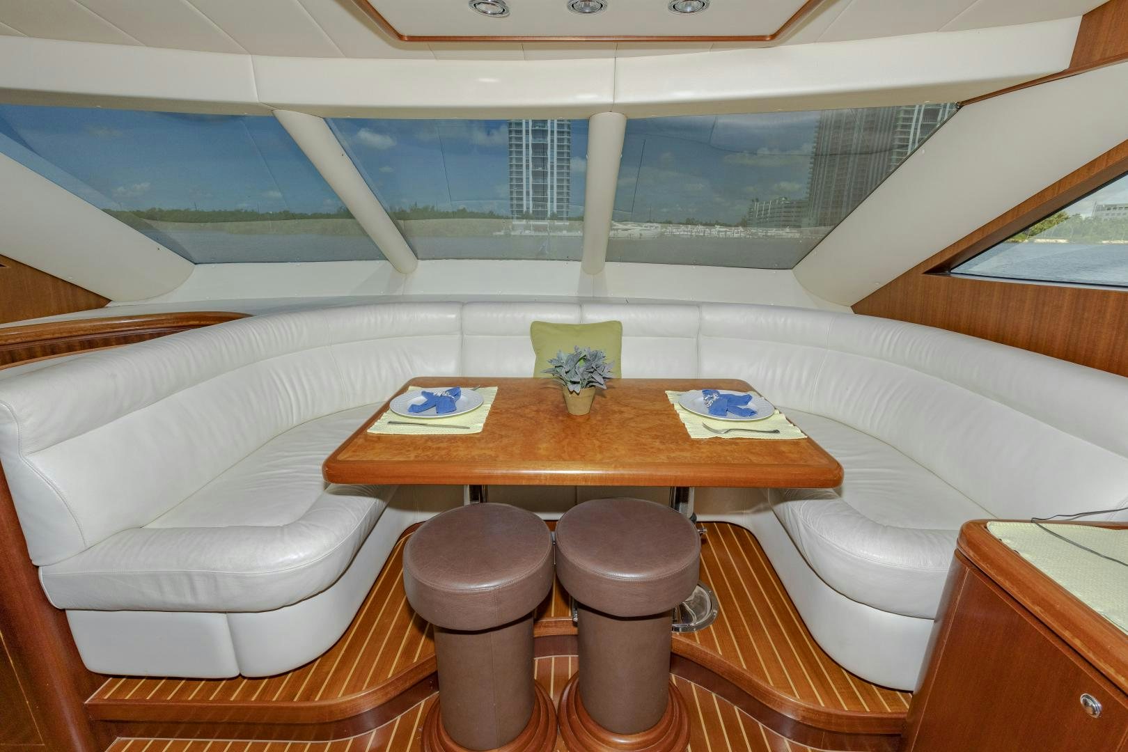a room with a table and chairs aboard VIAGGIO Yacht for Sale