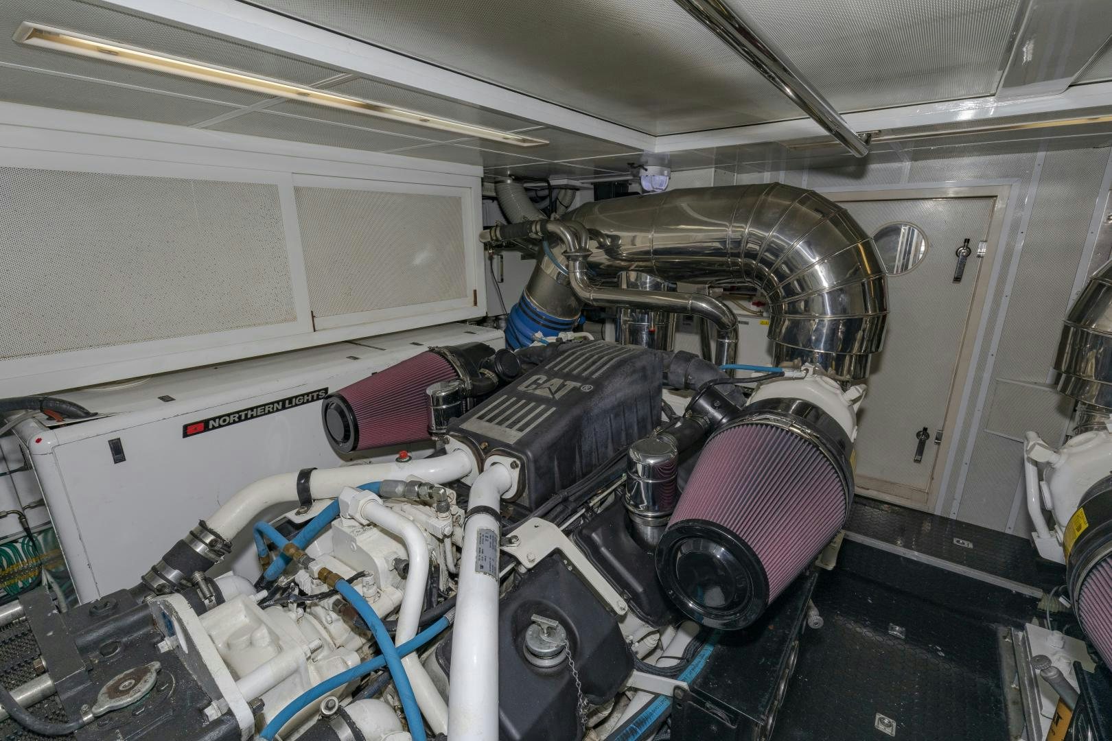 a car with a large engine aboard VIAGGIO Yacht for Sale